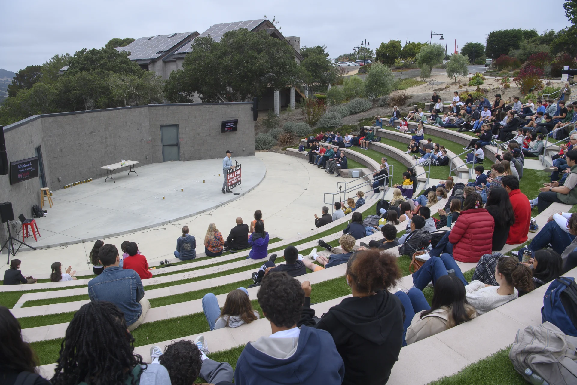 attendees seated at outdoor theater